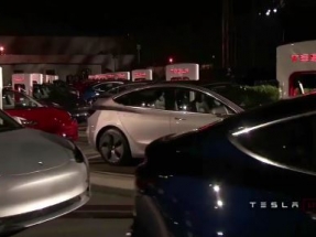 Tesla delivers first of its lower-cost Model 3 cars